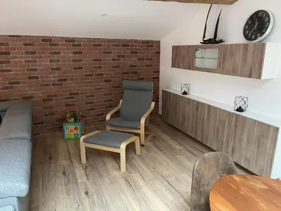 a living room with a brick wall and two chairs at Industrial Lodge 85m² - Loft avec extérieur in Revel