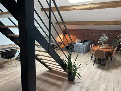 a living room with a piano and a table at Industrial Lodge 85m² - Loft avec extérieur in Revel