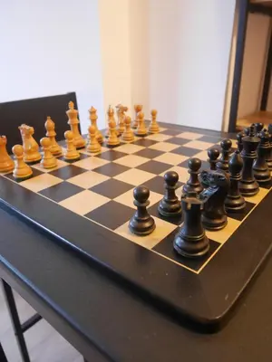 a chess board with chess pieces on a table at Le Laurenti in Quérigut