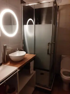 a bathroom with a sink and a shower and a toilet at Studio mer Neuf Port la Nouvelle in Port-la-Nouvelle