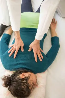 a man and a woman laying on a bed with their hands at Zen Experience including Yoga & Healthy food in Ladern-sur-Lauquet