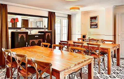a dining room with wooden tables and chairs at Cozy Home In Stjean-De-Minervois in Saint-Jean-de-Minervois