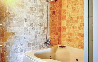 a bath tub in a bathroom with a shower at Cozy Home In Stjean-De-Minervois in Saint-Jean-de-Minervois