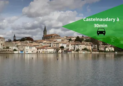 a view of a city from the water with a bus at Le Limouxin jungle Wifi, petit balcon *Oc Keys in Limoux