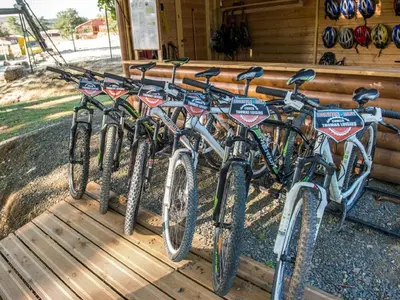 a row of bikes parked on a porch at Scenic Retreat w Terrace in Quillan