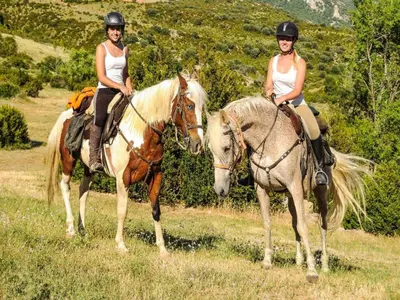 two women are riding on horses in a field at Pet-Friendly Home w Garden in Quillan