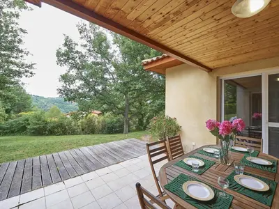 a table with plates on it on a patio at Pet-Friendly Home w Garden in Quillan