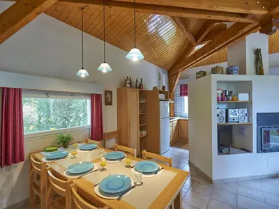 a kitchen and dining room with a table and chairs at Pet-Friendly Home w Garden in Quillan