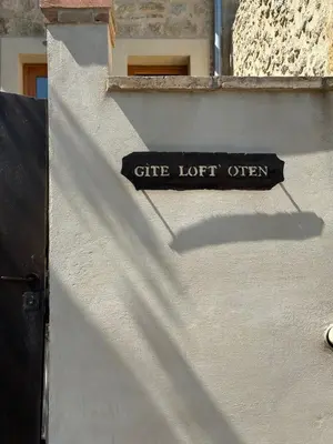 a sign on the side of a building at Les gîtes du Canal du midi - Gîte Loft'Oten in Avignonet-de-Lauragais