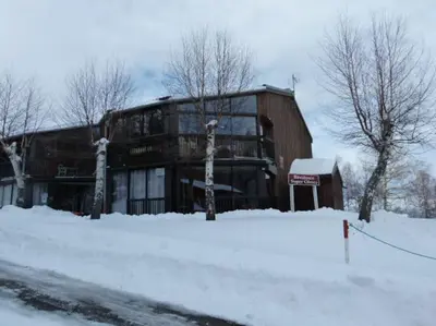 a large building in the snow in front at Logement dans chalet à la montagne in Montferrier
