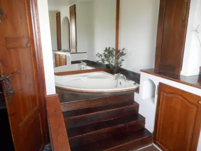 a bathroom with a sink and a bath tub at Logis de La Meschaussée, dans donjon du XIe siècle in Canet d'Aude
