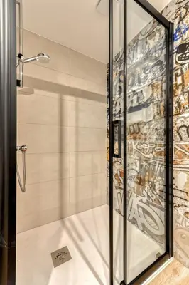a shower with a glass door in a bathroom at Villa Terracotta - 8 Personnes - Proche de la mer in Peyriac-de-Mer