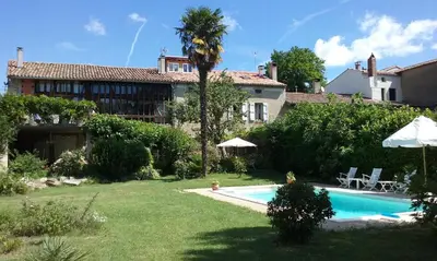 a house with a swimming pool in a yard at Maison du Breilh in Mirepoix
