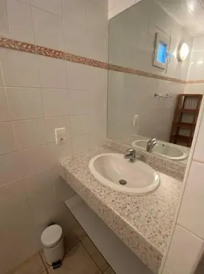 a bathroom with a sink and a mirror at Charming house in Espinet domain in Quillan