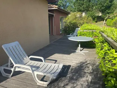 two chairs and a table on a patio at Charming house in Espinet domain in Quillan