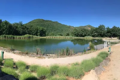 a body of water with mountains in the background at Charming house in Espinet domain in Quillan