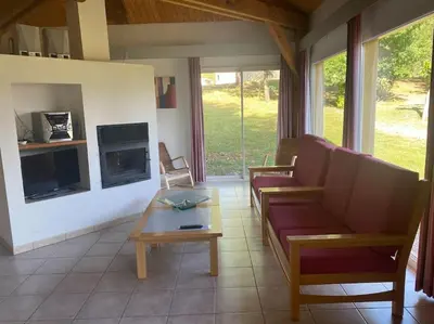 a living room with a couch and a table at Charming house in Espinet domain in Quillan