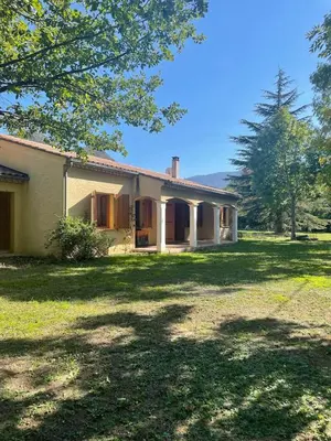 a house with a large yard in front of it at Quillan Villa with Pool in Quillan