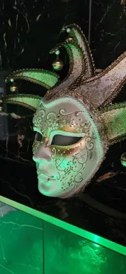 a mask with a dragon on top of a table at Loft & spa d'Autan in Villefranche-de-Lauragais