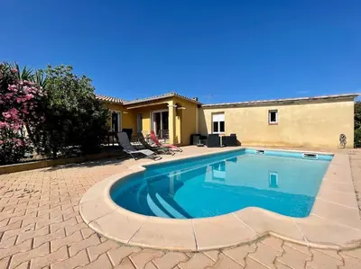 a swimming pool in front of a house at Villa La Paz ※ Climatisée in Lézignan-Corbières