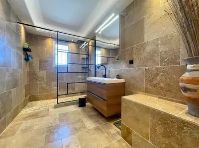 a bathroom with a sink and a glass shower at Villa La Paz ※ Climatisée in Lézignan-Corbières