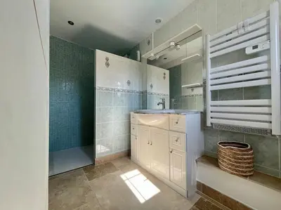 a bathroom with a sink and a shower and a mirror at Villa La Paz ※ Climatisée in Lézignan-Corbières
