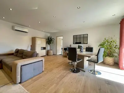 a living room with a couch and a table at Villa La Paz ※ Climatisée in Lézignan-Corbières