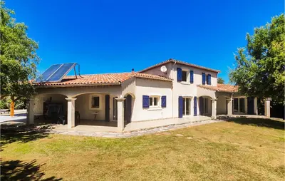 a house with a solar panel on the roof at Beautiful Home In Prades-Sur-Vernazobre in Prades-sur-Vernazobre
