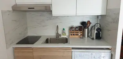 a kitchen with a sink and a counter top at Studio Gruissan Vue Port in Gruissan