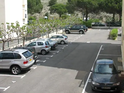 a group of cars parked in a parking lot at Studio Gruissan Vue Port in Gruissan