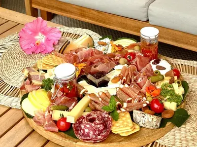 a plate of food on top of a table at Tropical Lodge SPA Narbonne in Narbonne