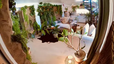 an overhead view of a living room with plants at Tropical Lodge SPA Narbonne in Narbonne