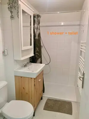 a bathroom with a sink and a toilet and a shower at Gîte de France Chez Fati in Les Brunels