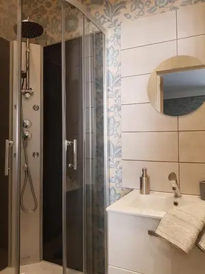 a bathroom with a shower and a sink at La Scierie in Quillan