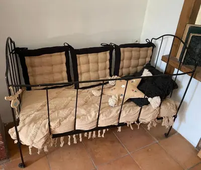 a black bunk bed in a room at Du côté de chez nous in Cuxac-dʼAude