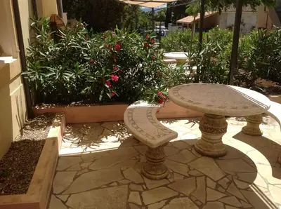 a stone table and bench sitting on a patio at Marsanne cottage for 2 and 2 people in the heart of the vineyard in Badens