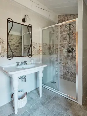 a bathroom with a sink and a shower at Domaine de Roquenégade - Piscine, sauna et bain nordique in Pradelles-en-Val