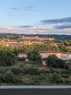 a view of a city with buildings and trees at Appartment - vue imprenable sur la cité médiévale - Parking gratuit - Climatisé in Carcassonne