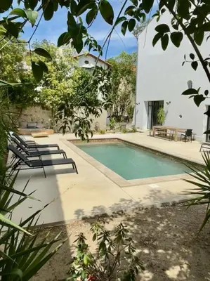 a swimming pool in front of a white building at Grande Maison de Maitre contemporaine à 10 min de la mer et Piscine in Salles-d'Aude