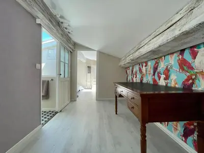 a room with a desk and a wall with a mural at Le Balcon de Gambetta ※ in Carcassonne