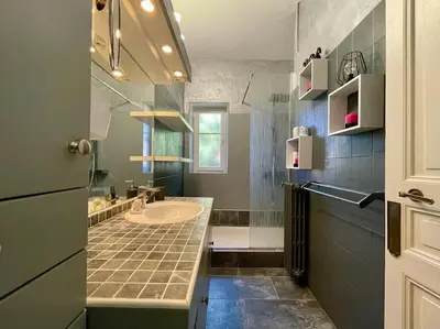 a bathroom with a sink and a toilet in it at Le Balcon de Gambetta ※ in Carcassonne