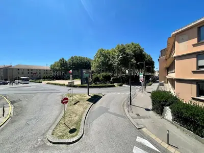 an empty street with a stop sign in the middle at Le Balcon de Gambetta ※ in Carcassonne