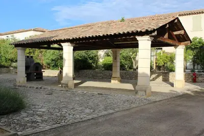 a pavilion with a fire hydrant under it at Maison provençale en Corbières in Saint-Laurent-de-la-Cabrerisse