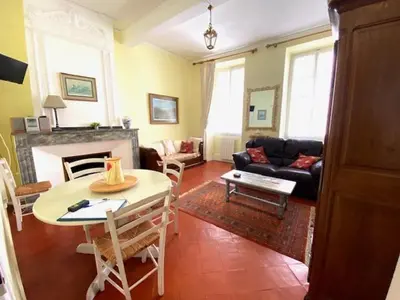 a room with a table and a floor with a star on it at Maison Ville-Limoux in Limoux
