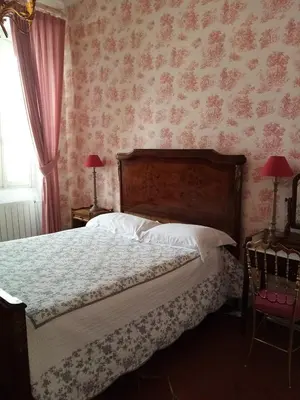 a living room with a table and a couch at Maison Ville-Limoux in Limoux