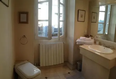 a living room with a couch and a fireplace at Maison Ville-Limoux in Limoux