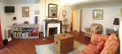 a bedroom with a bed and a desk and a mirror at Maison Ville-Limoux in Limoux