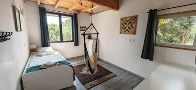 a small room with a bed and a window at Grande maison Carpediem, le calme à la campagne in Cassaignes