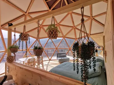 a room with a bed in a tent at Le dôme géodésique in Ansignan