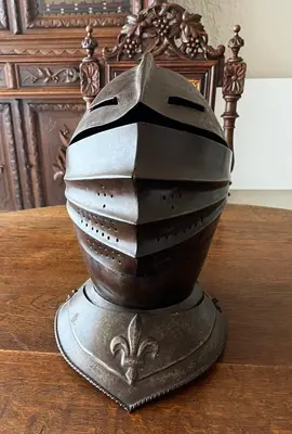 a metal object sitting on top of a wooden table at La Halte Louis XIII in Bram